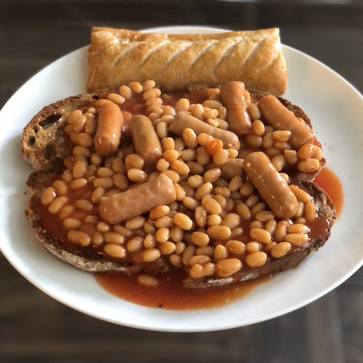 . <a href="/ratemyplatenow/">Rate My Plate 🍽️</a> Sourdough toast, baked beans with mini sausages, <a href="/GreggsOfficial/">Greggs</a> sausage roll. Vinegar garnish #ratemyplate