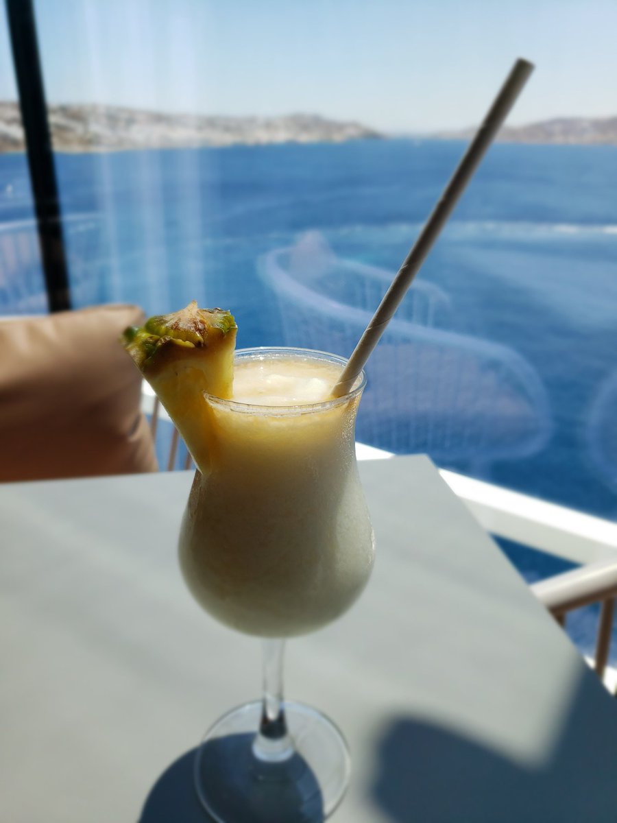 byTrishaBarnes's tweet photo. Just minding my own business, having a delicious #pinacolada at the #OceanviewCafe overlooking #Mykonos. Smells like 70s #HawaiianTropic suntan lotion and tastes like #heaven. Best #Monday ever. #prettydamngood #illhaveanother #CelebrityApex #GreekAloha #drinkpackage https://t.co/njXsbgXlJX