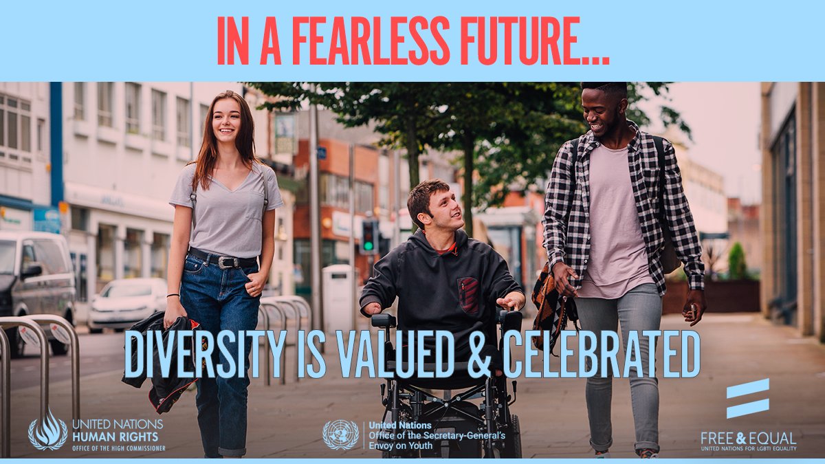 A group of young people one of which is a wheelchair user are going down the street; the tagline reads “In a fearless future… diversity is valued & celebrated”