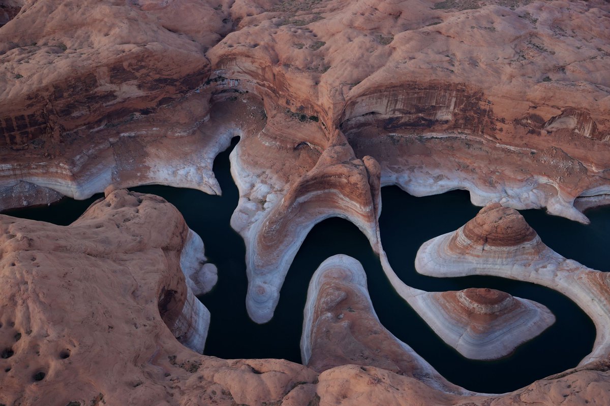 sullyfoto's tweet photo. Water levels are at historic lows at Lake Powell as the flow of water slows in the Colorado River Basin. The lake is currently at 34% of capacity - 138 feet below full pool. The Colorado River Basin supplies water to 40 million people in 7 western states. #Drought2021 #drought https://t.co/Vis7uC5bQm
