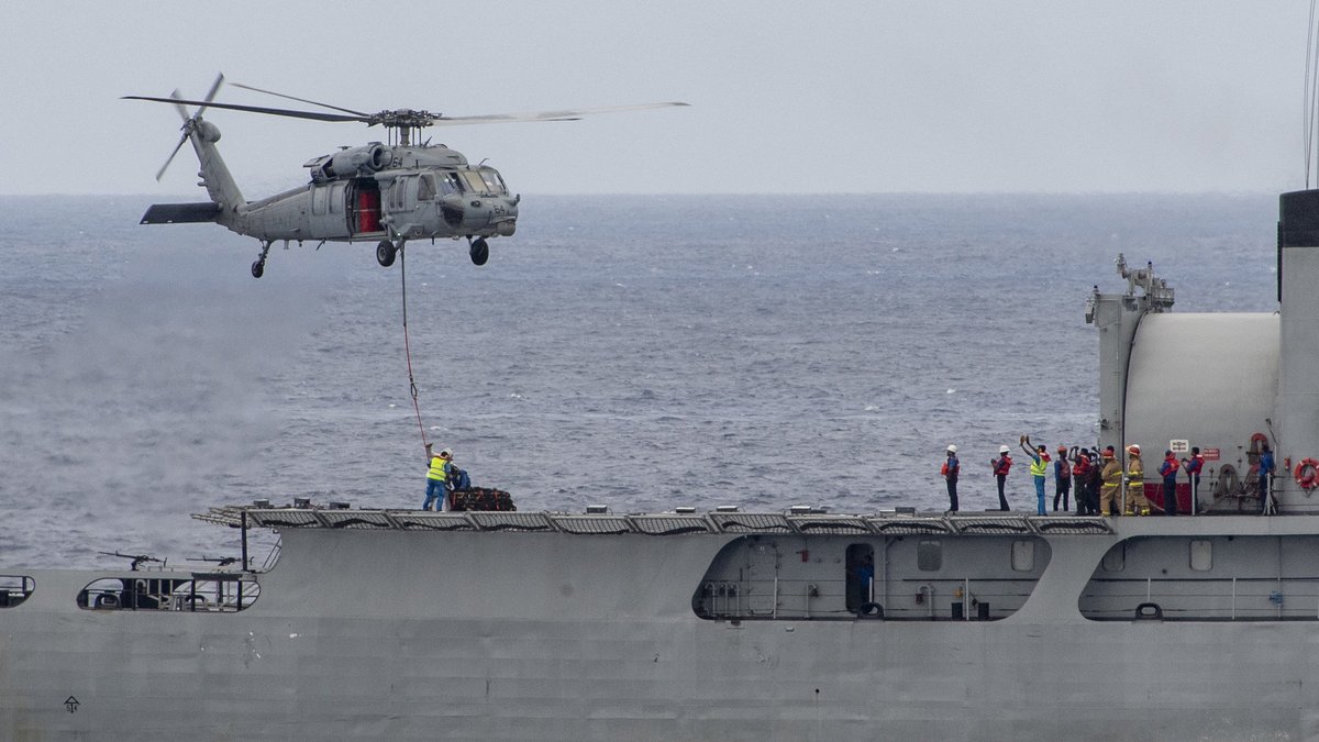 A #USNavy MH-60S Sea Hawk attached to Helicopter Sea Combat Squadron #HSC21 and #USSCharleston (LCS 18) transfers cargo during a vertical replenishment drill with @srilanka_navy's SLNS Gajabahu (P626) and SLNS Sayurala (P623) as part of exercise CARAT Sri Lanka. #NavyPartnerships