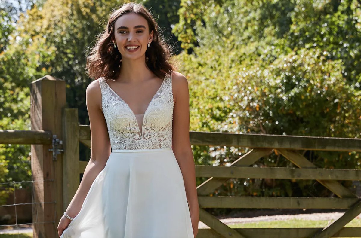 PB127 | This is a gorgeous choice for a Spring / Summer wedding, with it's striking lace, sparkling detail and flowing chiffon skirt. bit.ly/3hOPTf5

#purebridal #affordableluxury #romanticacollections
