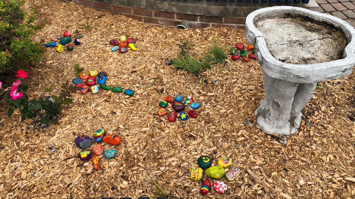IHHSLibrary's tweet photo. The GSA and Interact clubs collaborated to create rainbow rocks for #PrideMonth. Check out the colorful display in the front courtyard! https://t.co/307sDuE0C5