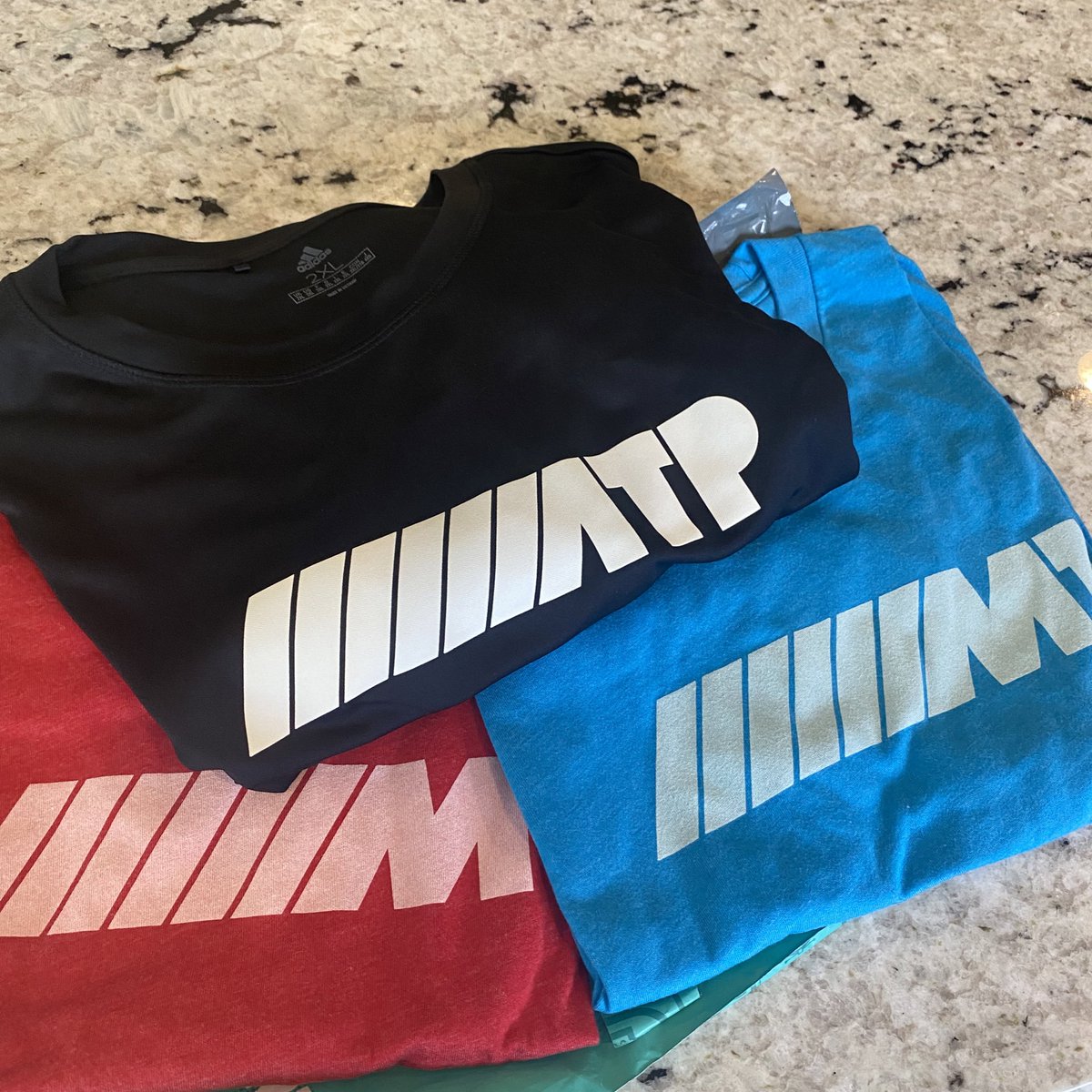 RyanTufo's tweet photo. This year’s @atpfm loot is awesome. Love the Siracusian M1 render and the athletic shirt is probably my fav workout shirt to date. Great stuff! @siracusa @marcoarment @caseyliss https://t.co/v7JOiC3nKk