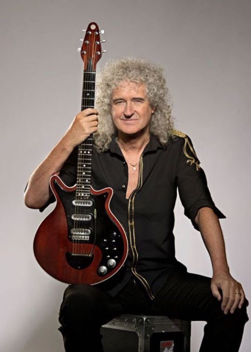 I love this photo sooo much. 
Not posing with his wife, pets, or family
But his famous hand made guitar.
I love the Dr. Brian May