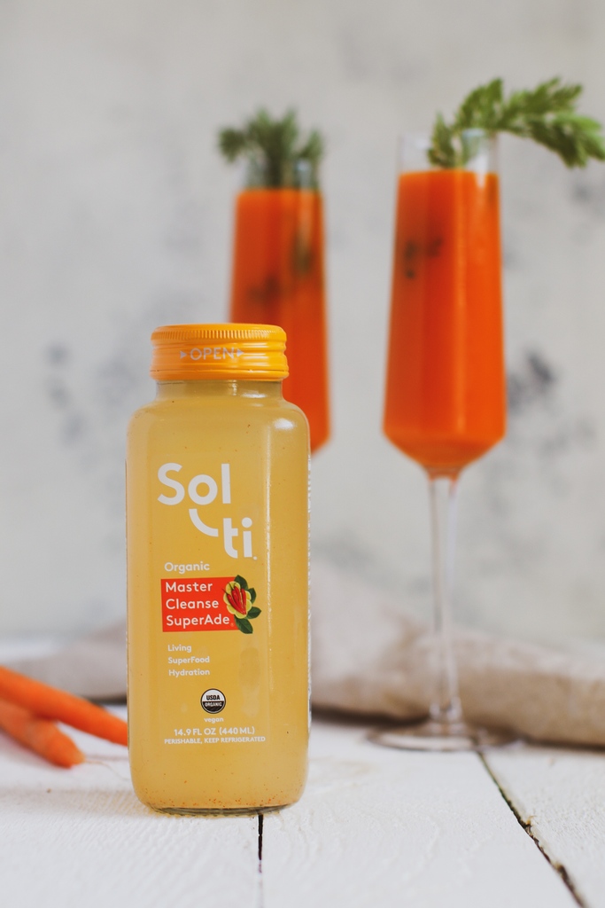 Master Cleanse Carrot “Mimosas” 🌶🥕⁠ Ingredients: •2 cups Carrot Juice ⁠ •1 bottle Sol-ti Master Cleanse SuperAde ⁠ •1 tbsp maple syrup ⁠ •½ cup sparkling water ⁠ Method: 1.Mix all of your ingredients together in a pitcher. ⁠ 2.Serve with carrot top greens! 🌿⁠ ⁠