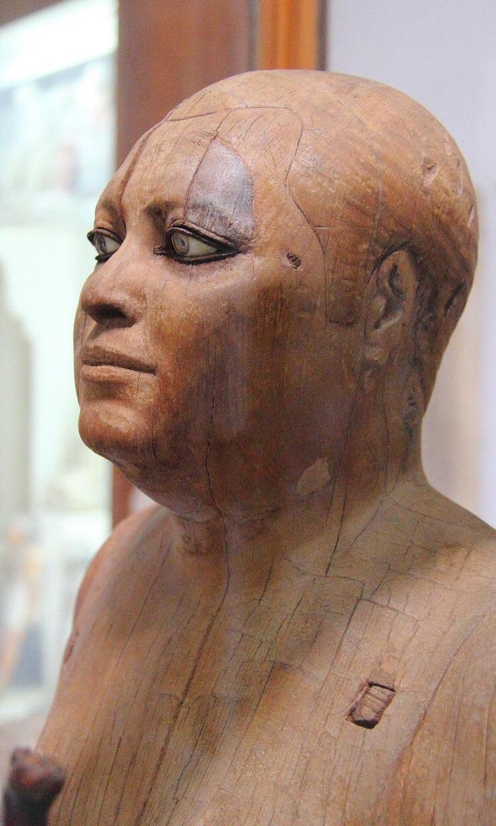 4600 year old Egyptian statue made primarily from wood has eyes made from rock crystal and small copper plates.