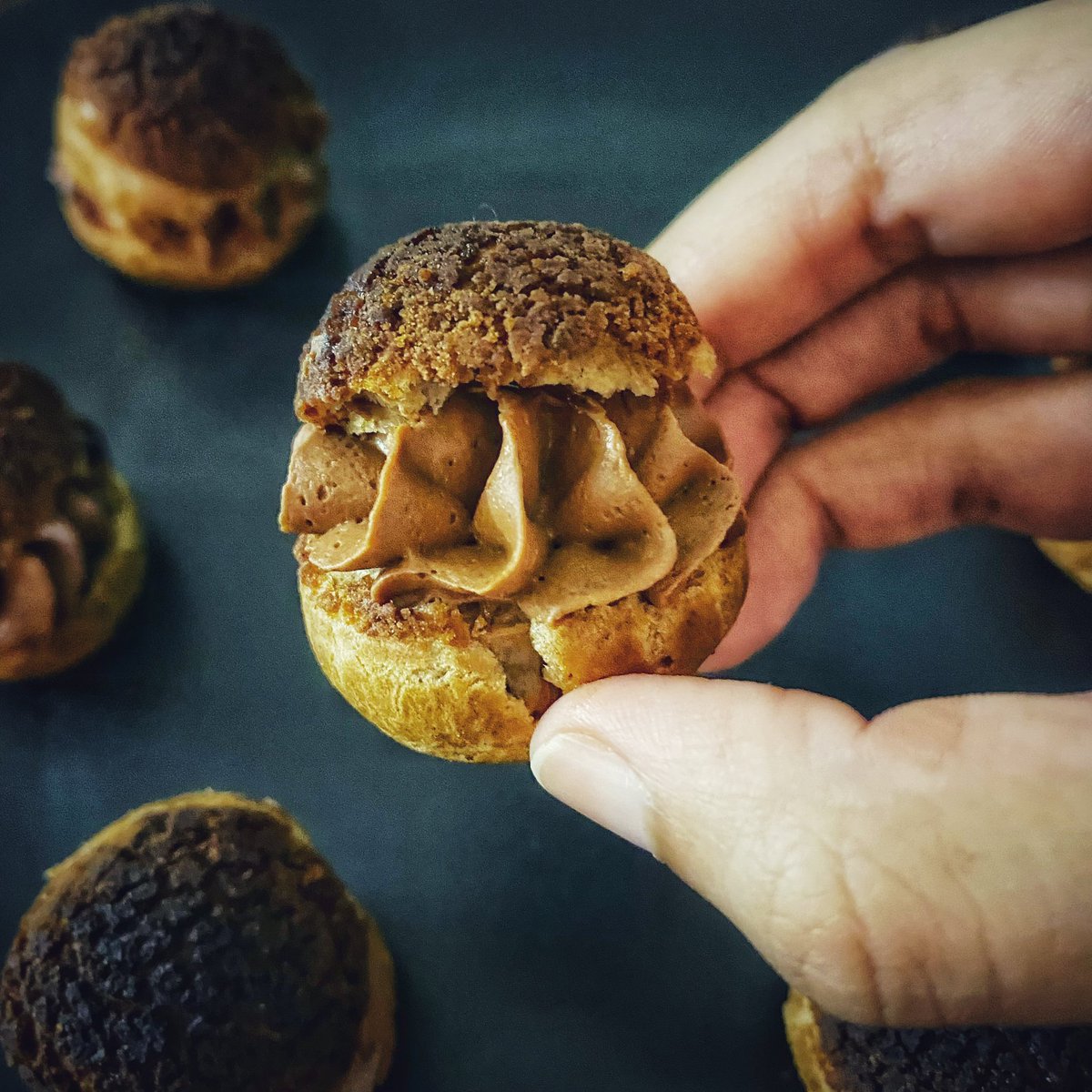shreyadeshpande's tweet photo. Mini #choux anyone? Baked choux au craquelin with a chocolate creamaux and hazelnut praline. Absolutely loved making these mini oysters of joy π€© #bake #baking #loveforbaking #bakingtherapy #chocolate #callebaut #frenchpatisserie https://t.co/EzdgvkOAyT