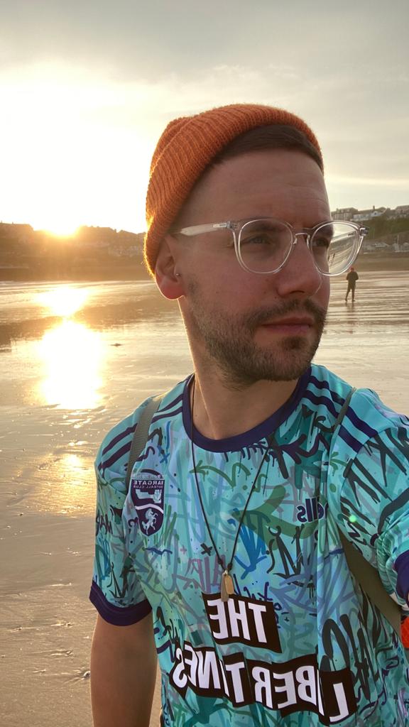 WinksFootball's tweet photo. I forgot to actually post #PrideKitChallenge for day 8 but I was in a sky blue shirt all day. 
So here Is @margate_fc goalkeeper shirt 20-21 whilst the sun was going down in Newquay. 💙 #Imsovain 🤣 https://t.co/WxpjKvoGTW
