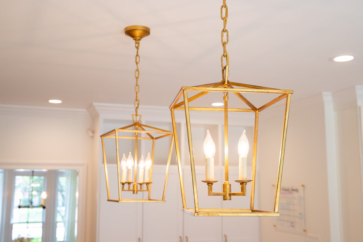 What do you think of this white kitchen with gold trim by Tim Disalvo?