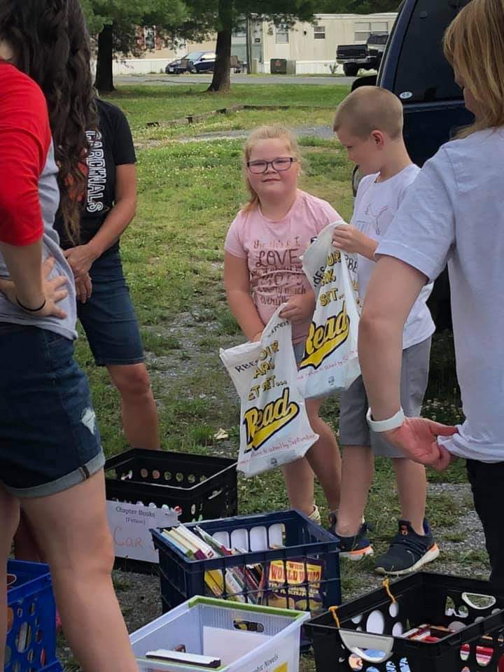 PrincipalSmartz's tweet photo. Many more kids and families showed up for our first run of Books Express than you see here! It was a great evening connecting with current, old and new students; we handed out oodles of books!  It takes a team! @RBESCardinals @AlgerLibrarian https://t.co/hvLD22EMvs