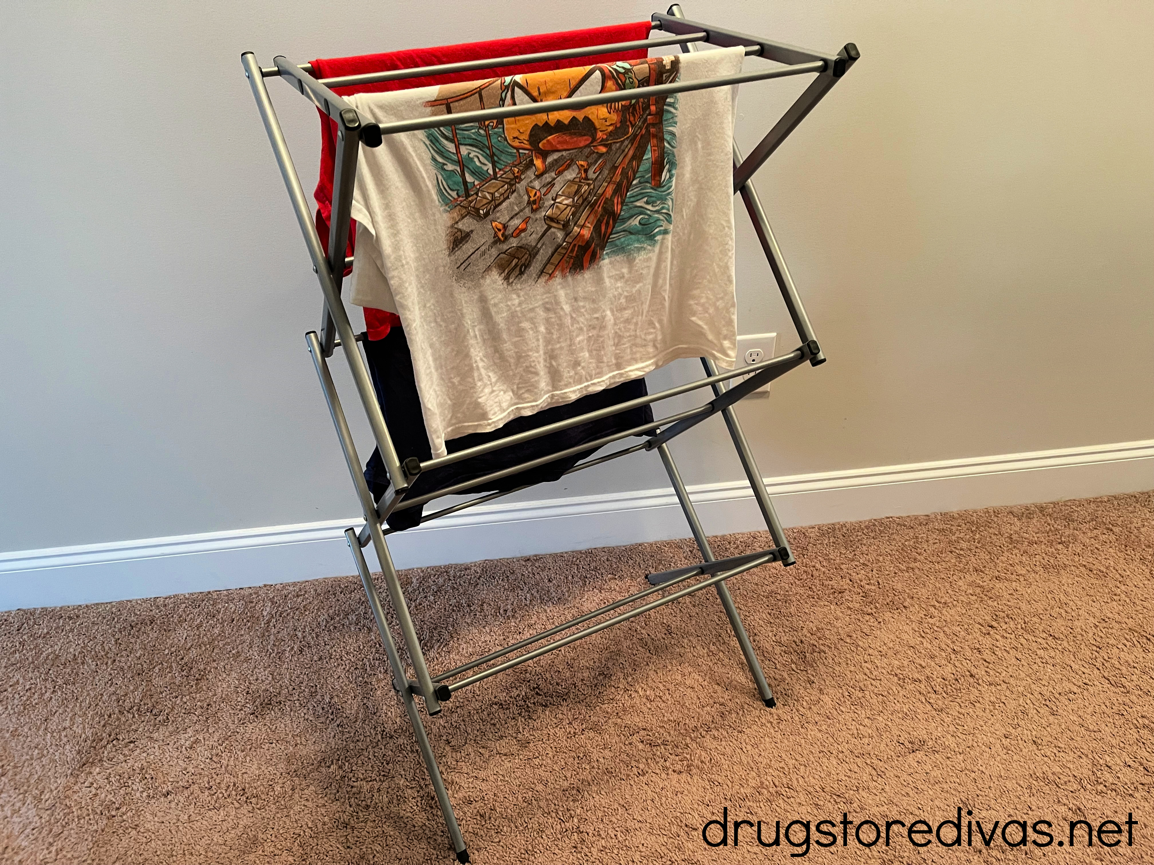 A drying rack with clothes on it.