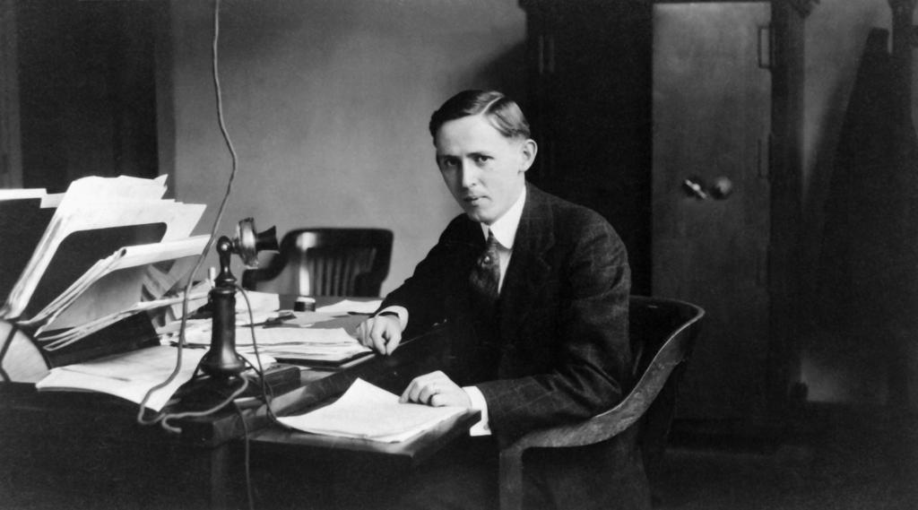 John Victory sitting at his desk