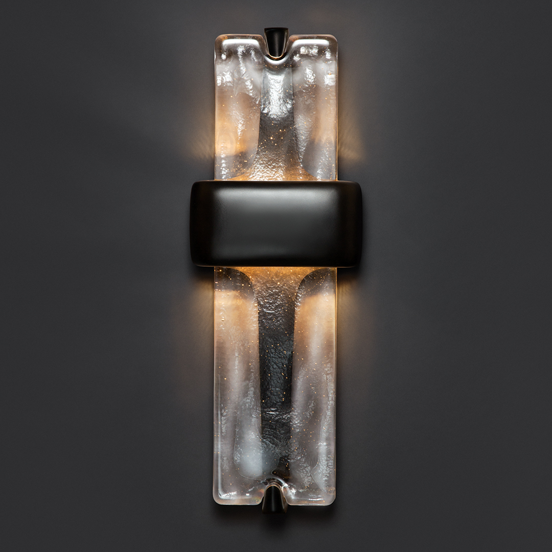 HollyHuntDesign's tweet photo. The Vesta Sconce, designed by #PaulMathieu, is a contemporary reimagining of a torch: handcrafted glass cast with rhythmic undulations and paired with a bronze frame. Available in two finishes through our In Stock program. 
  
#HOLLYHUNT #sconce #lighting #design #interiordesign https://t.co/pfrk3XG9ow
