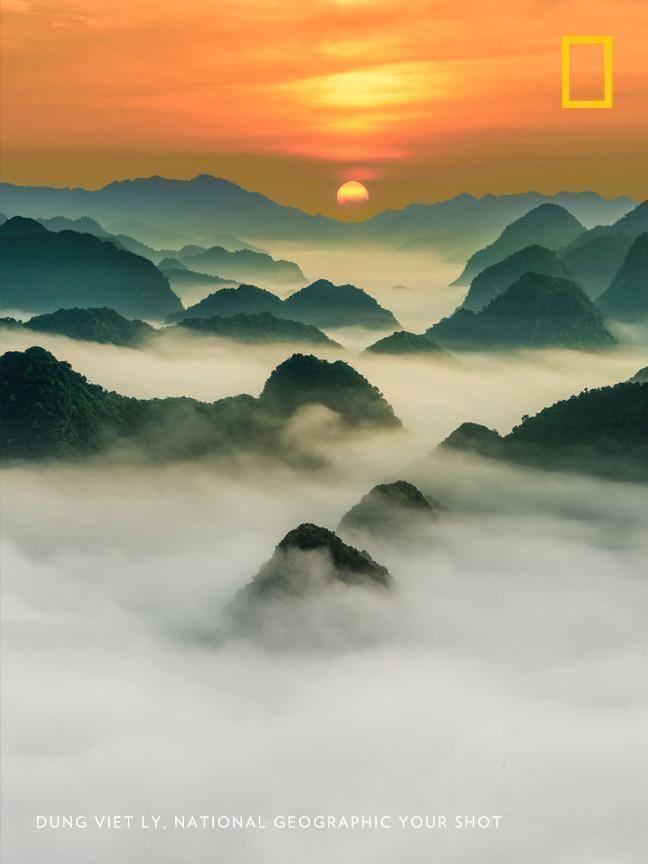 NatGeoTravel's tweet photo. Layers of clouds and mountains recede into the distance in this brilliant sunrise image by #YourShotPhotographer Dung Viet Ly. https://t.co/nNvIlYgQiC