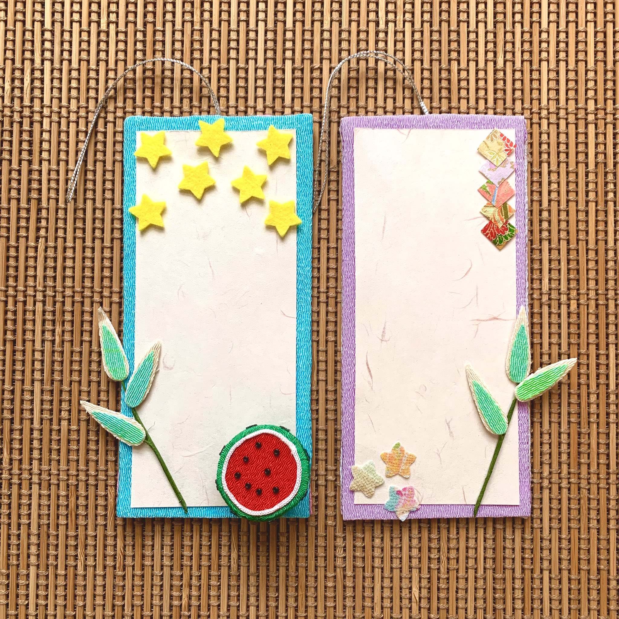 ファミリアミア ちりめん生地を使って短冊を作りました 左 フェルト星 笹枝 ちりめん細工のスイカ 右 和紙の菱飾り 笹枝 ちりめんシール星 七夕 七夕飾り 七夕制作 季節の飾り ちりめん細工 和紙 短冊 短冊に願いを込めて たなばた
