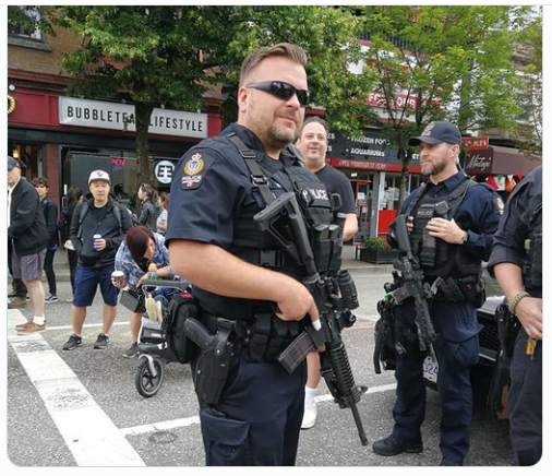 cie1947's tweet image. This is VPD at a Commercial Drive neighbourhood day.
Cops showing their paramilitary selves just because...
#AbolishThePolice #DefundVPD