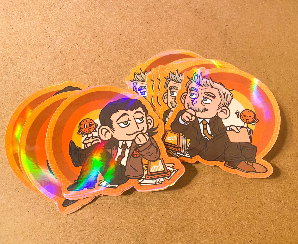 I gotta find some more fun office material backdrop props and take better pics tomorrow when there’s natural light but I’ve got some holo Loki and Mobius stickers up in the shop! 
etsy.me/3j554Dt