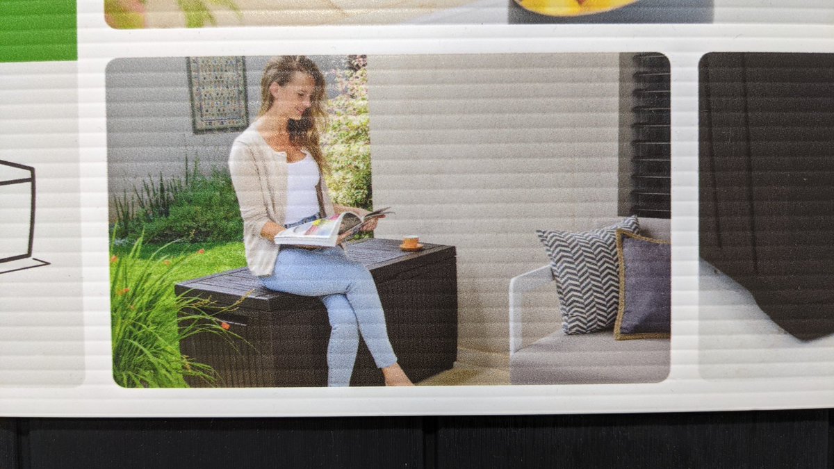 thestefmurphy's tweet photo. Best Ad of the day! Who in their right mind decided to sit on a box to read their book when a chair with pillows is right in front of them? #advertisingfail https://t.co/2wPQxQK4o1