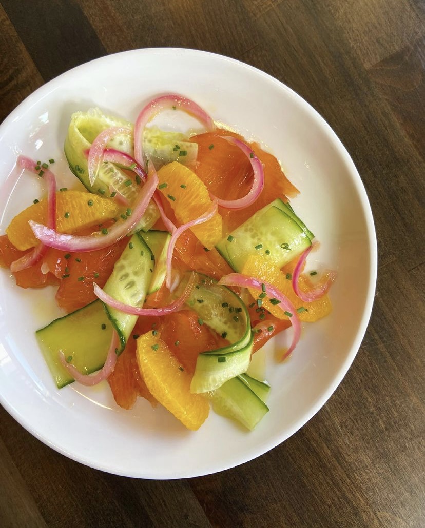This citrus cured salmon with orange, 🍊 cucumber, 🥒 pickled red onion, and EVOO  is summer 🌞 on a plate! Thank you Scarpe Restaurant for tagging us in this awesome photo.