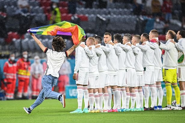 Of course the #Hungarian public TV #censored it, so here’s the photo of the heroic guy who ran into the #HUNGER football match with a #rainbowflag 🏳️‍🌈🏳️‍⚧️✊ #wewillnevergiveup
