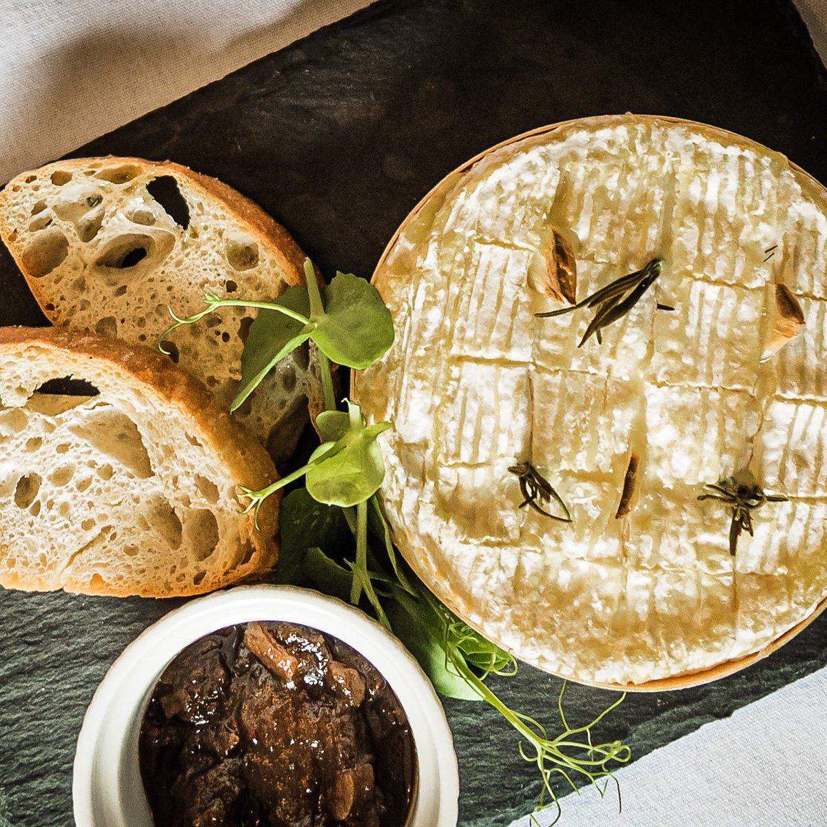 Baked Camembert roasted with garlic and rosemary. Served with toasted ciabatta and homemade chutney. A popular starter option.