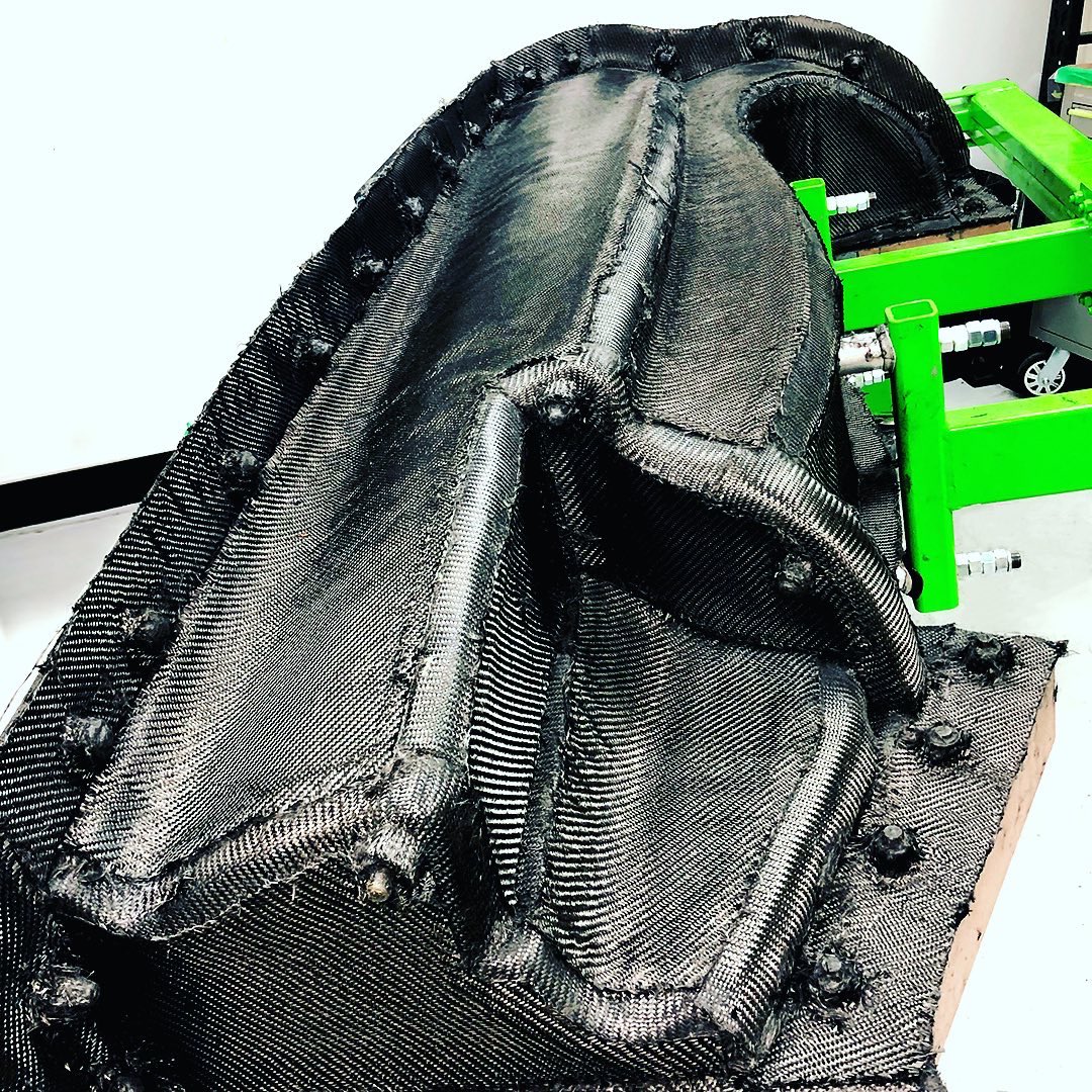 RodinCars's tweet image. Hand laying dry carbon fibre for resin infusion on the #rodinfzero mono mould build. Twill carbon fibre is placed to achieve a quasi-isotropic laminate. Next step, we vacuum bag the part and resin infuse with high temp tooling epoxy resin.#manufacturing #composite #engineering
