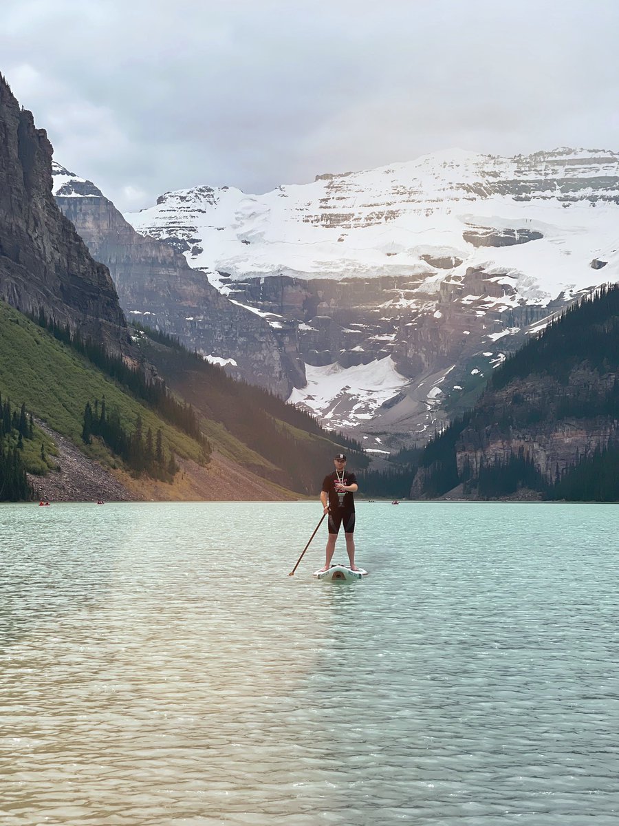 artSWC's tweet photo. Enjoying some time in #lakelouise this week with this awesome guy @ChapelskyCole - plus the view is nice too! #travelalberta #travelling #alberta #albertalake #yeg #yegtravel #paddleboarding https://t.co/oPHY5TOD99