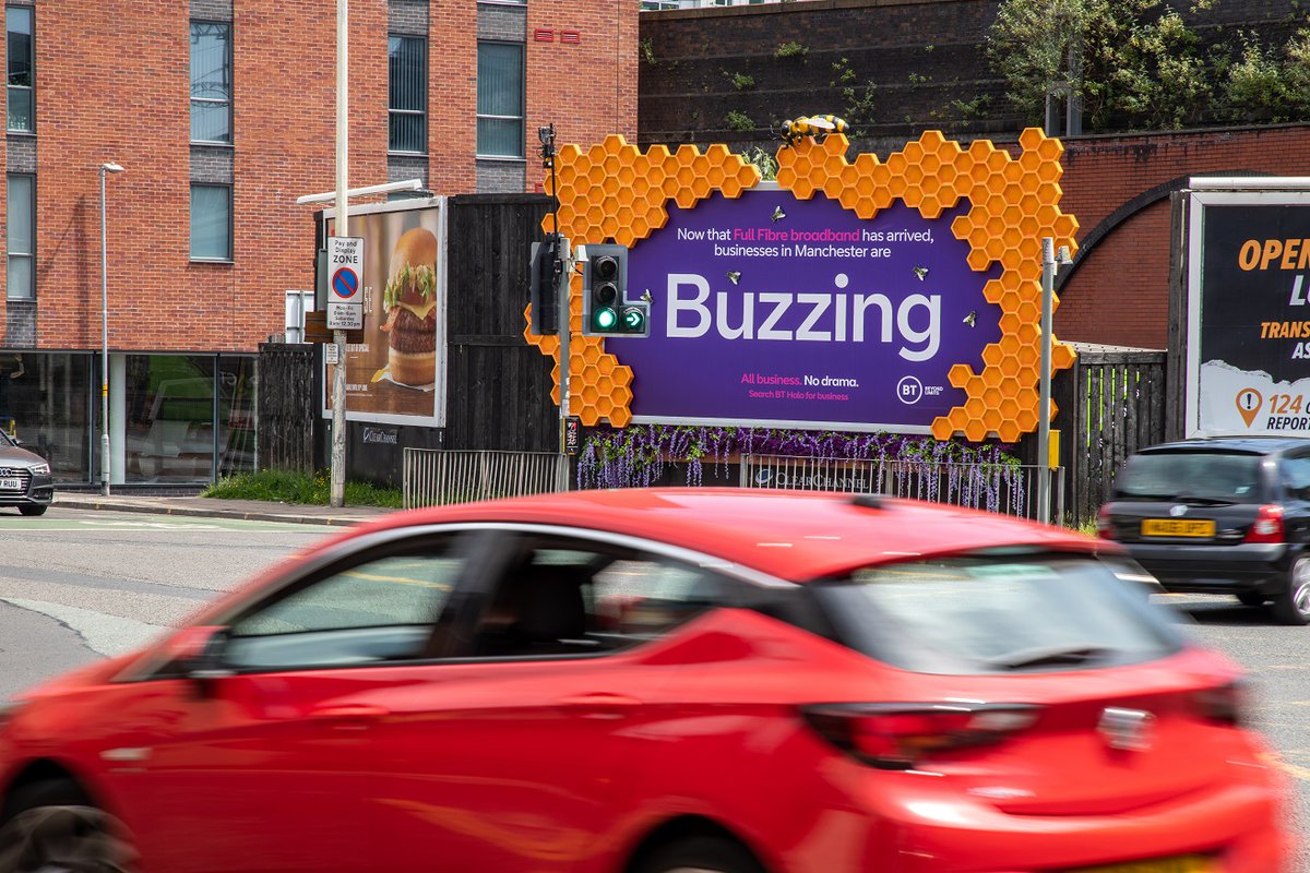 KerryCCUK's tweet photo. Un-Bee-Lievable! 🐝 Loving the latest @clearchanneluk special build #OOH installation from @BTBusiness, promoting their full fibre that's now available to businesses in Manchester. The buzzin billboards feature a giant 3D bee &amp; honeycomb, 2D bees, &amp; artificial plants.@Posterscope https://t.co/vGtUgpX2W1