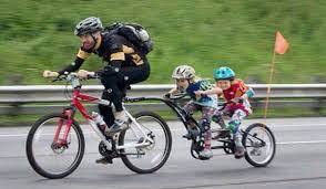 Today I have hope for humanity. Seen this morning: father &amp; son on school run via bicycle + tagalong. It was raining, too. (Generic pic)