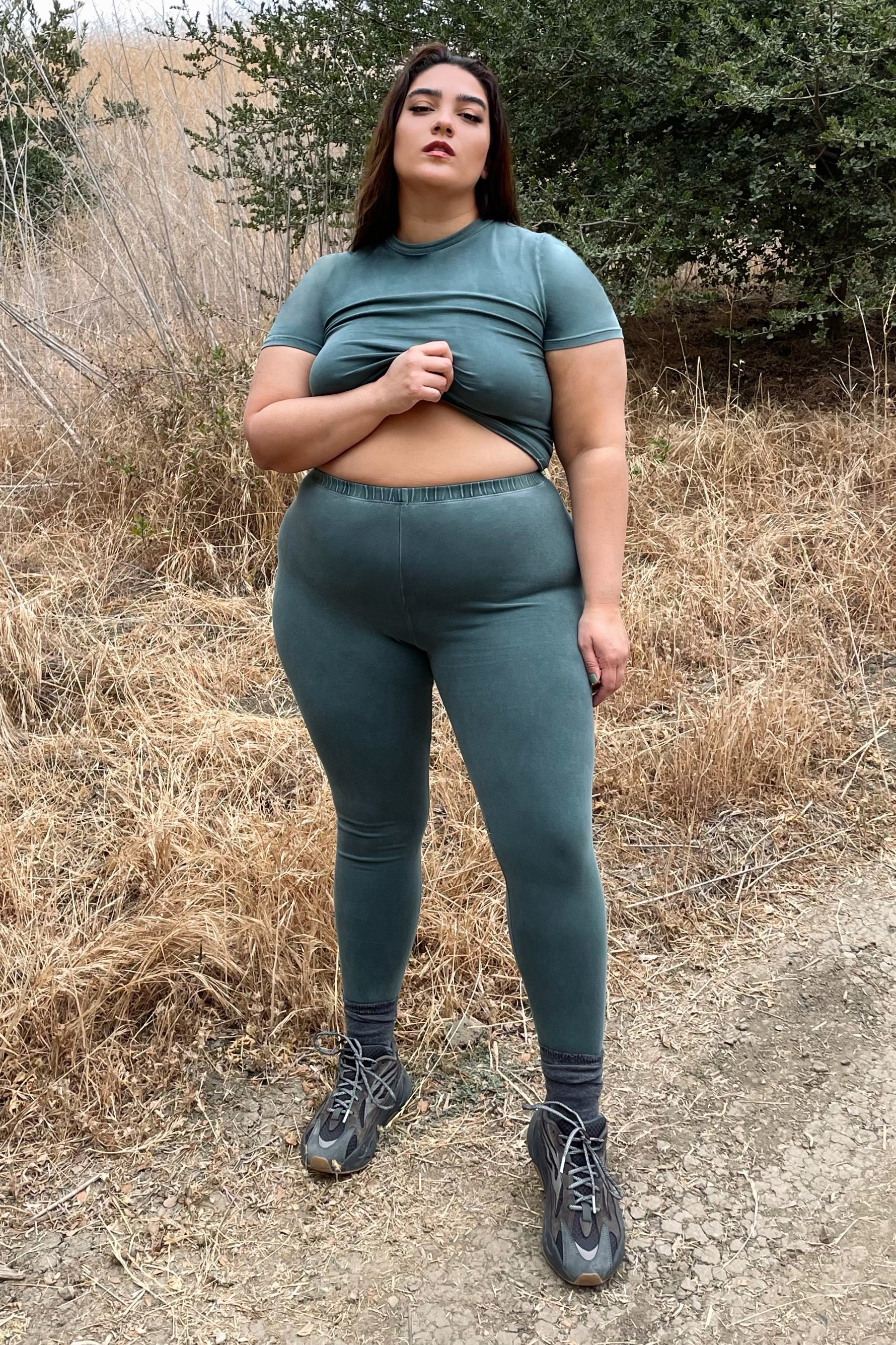 SKIMS on X: .@nadiaaboulhosn hits the trails in the Outdoor Basics T-Shirt  and Legging in Malachite. Our first outdoor collection is perfect for hikes  (and post-hike pics). Shop Outdoor Basics Drop 1