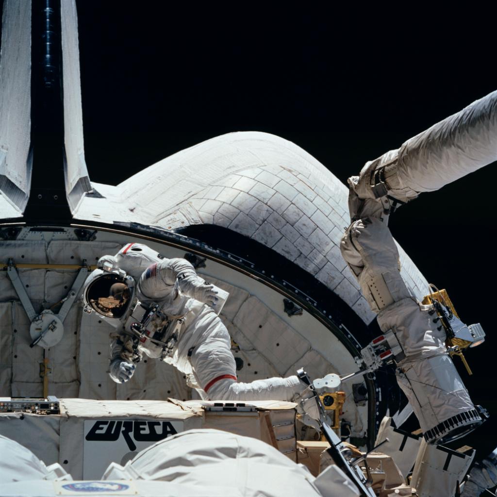 Astronaut on the outside of Space Shuttle Endeavour during a spacewalk.