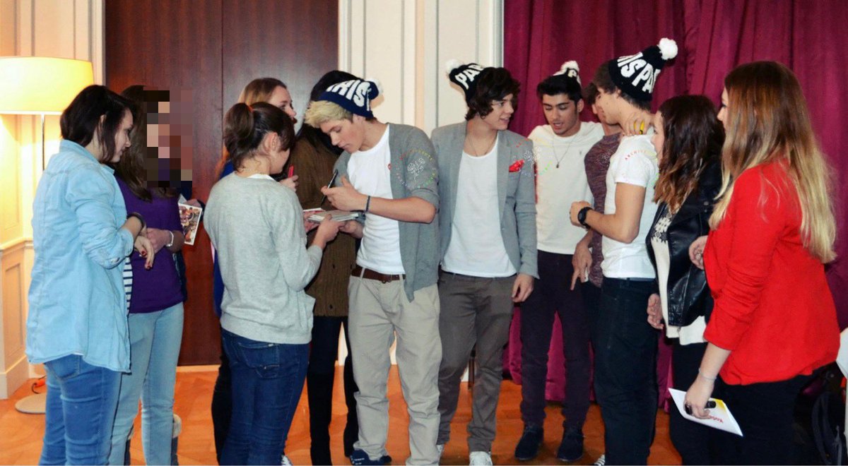 Full image of the boys during a meet and greet in Paris.