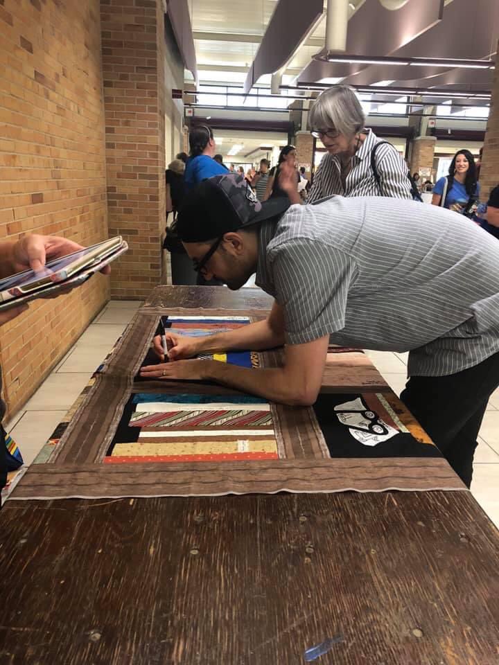 Teacher_AWebb's tweet image. Anyone remember the bookshelf quilt from #nErDCampMI ? This popped up in my memories today and this quilt has become so much more cherished because it was the last year of Nerd Camp MI. Missing all of you this week! 🤗 Thanks to ALL those who signed my quilt!