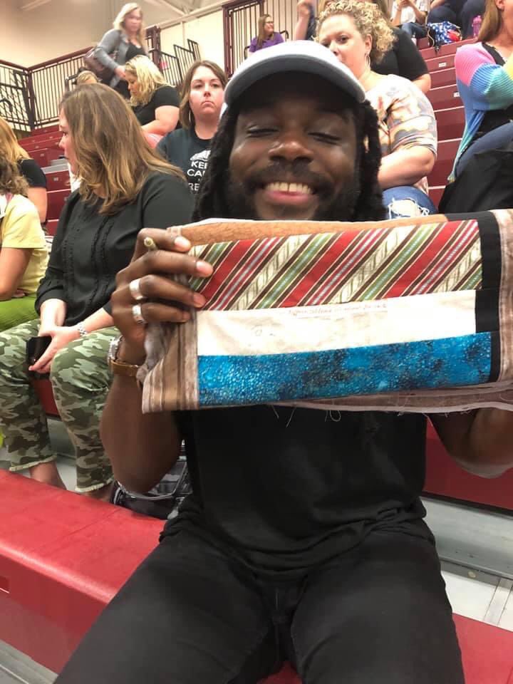 Teacher_AWebb's tweet image. Anyone remember the bookshelf quilt from #nErDCampMI ? This popped up in my memories today and this quilt has become so much more cherished because it was the last year of Nerd Camp MI. Missing all of you this week! 🤗 Thanks to ALL those who signed my quilt!