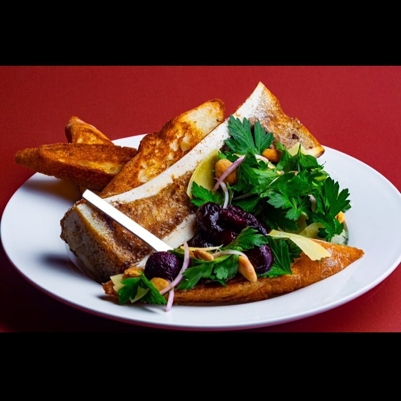 Final plating: Roasted bone marrow with red wine poached cherries, parsley salad, marcona almonds and toasted bread. 

The richness of the marrow gets beautifully cut by the herbaceous salad, rounded out by the sweet earthiness of the cherries with the b… instagr.am/p/CRIPw8spf74/
