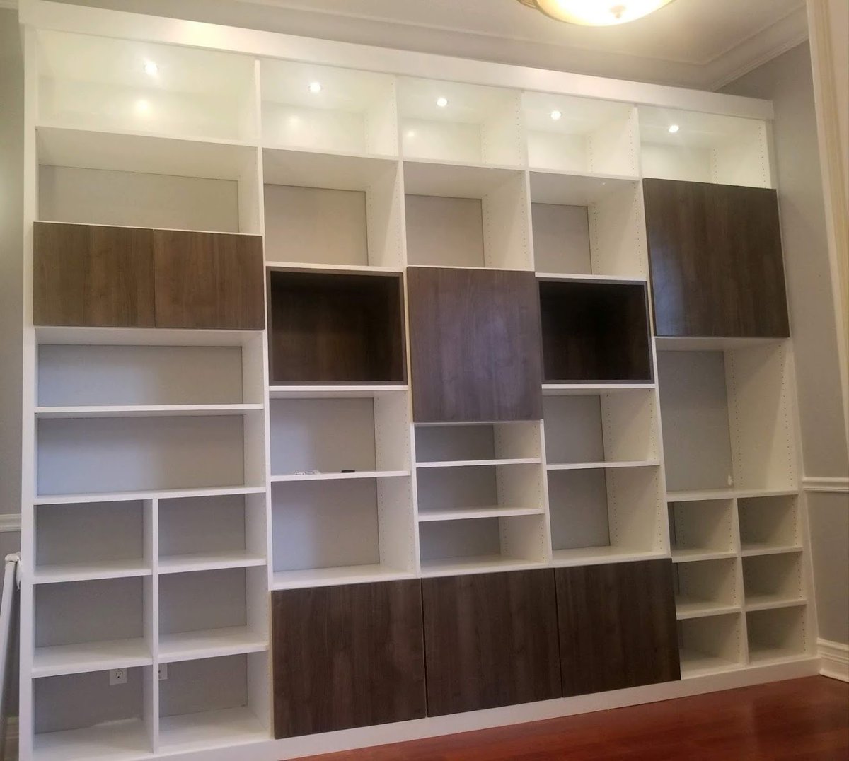 We love this geometric library. The two-tone look makes it a great place to display your valued possessions.