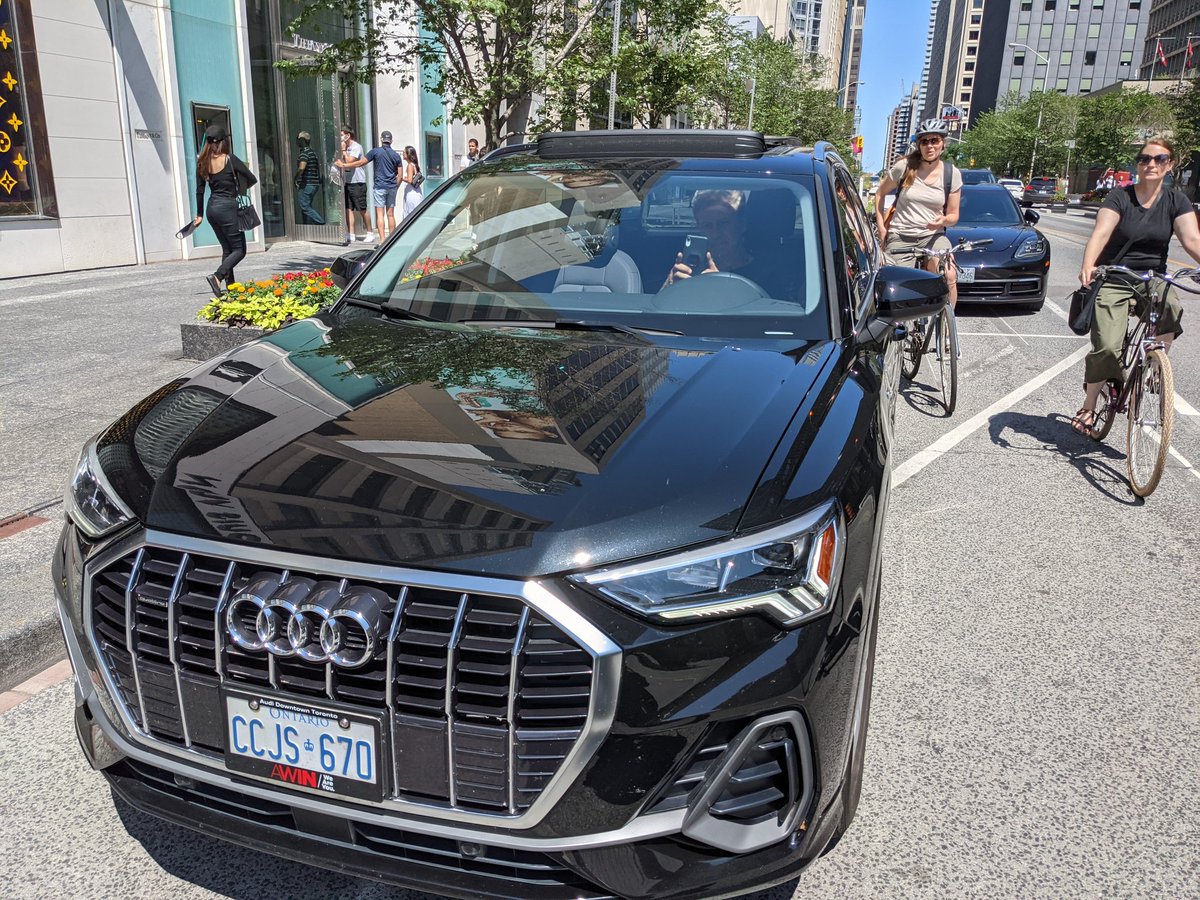 senning's tweet photo. @311Toronto this driver parked in the Bloor bikelane at Avenue. I knocked on his window to tell him it was a bikelane and he said he knew. I knocked again to ask him to move and he rolled down his window to tell me not to touch his car again, so I took a picture. https://t.co/xFmpVEQ15u