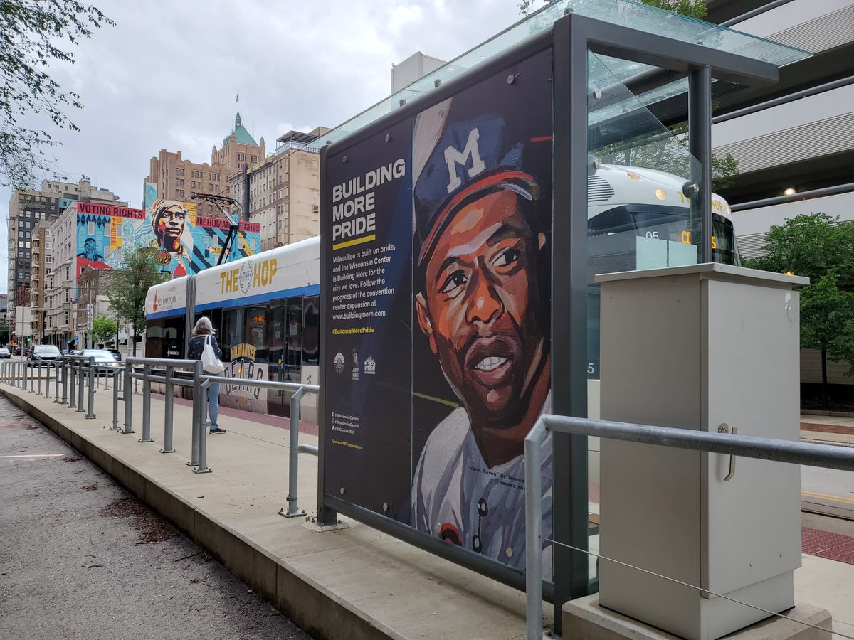 MilwDowntown's tweet photo. Milwaukee is built on pride, and the @WICenterMKE is Building More for the city we love. Now on display at @thehopmke streetcar shelters, Milwaukee legends by local artist Teresa Sahar.
#jumpstARTdowntown
#BuildingMorePride https://t.co/AJOoNUoQNH