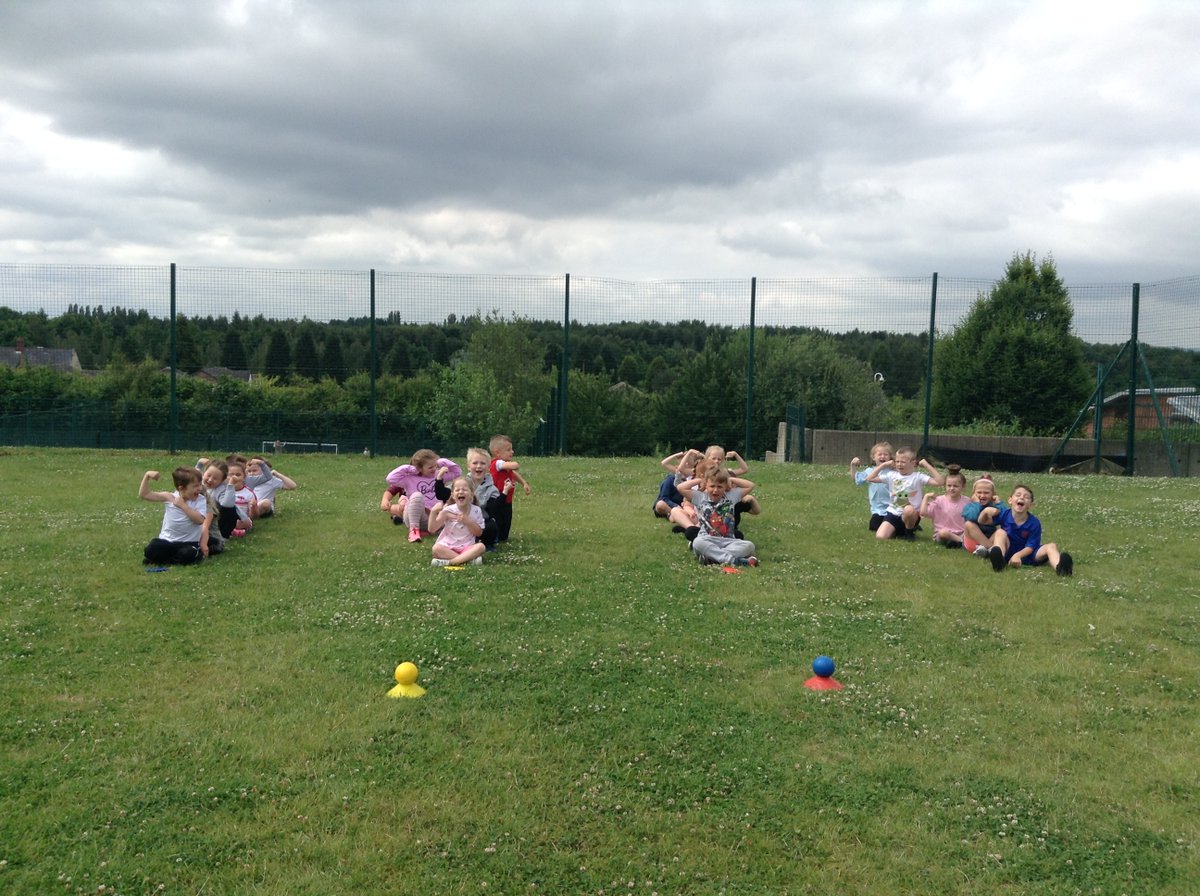 Showing off our muscles ready for the shot put activity!