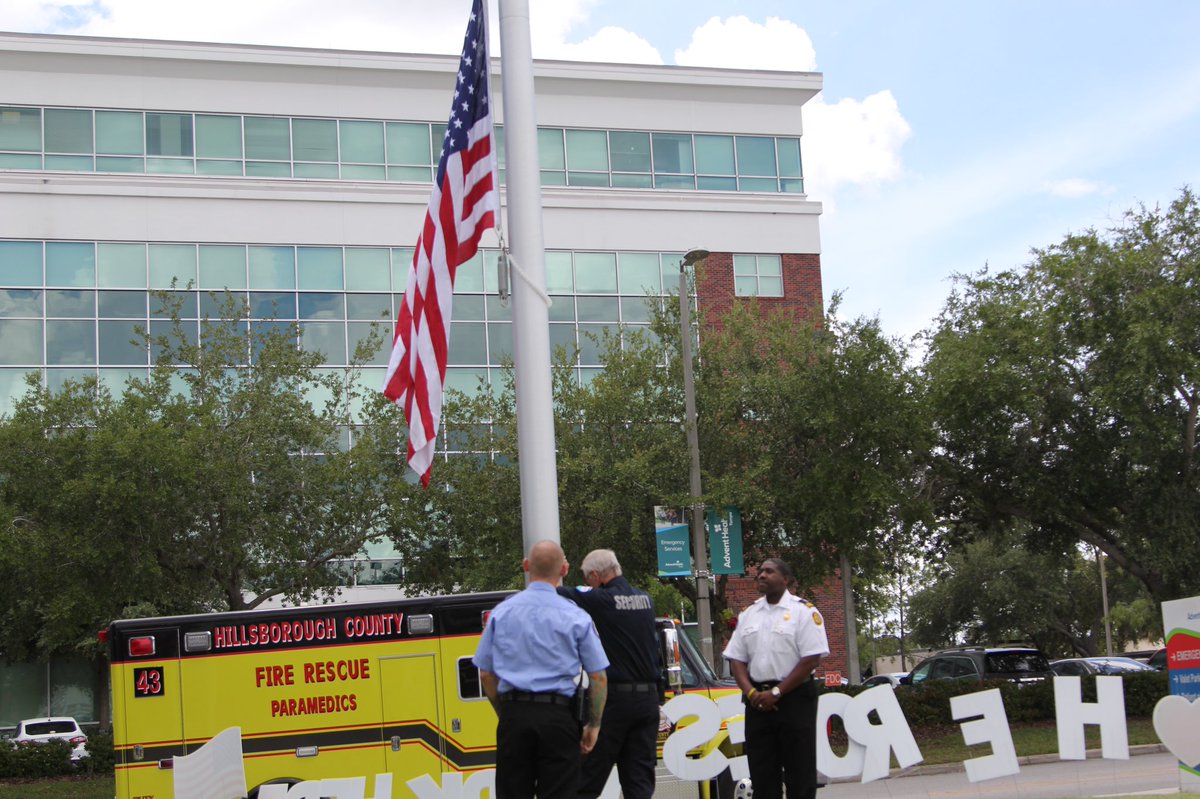 HillsFireRescue's tweet photo. We want to thank @AdventHealth #Tampa for inviting us to their Flag dedication. Responders from all over @HillsboroughFL were represented and thanked for their service to the community. HCFR had the honor of assisting with the raising of the flag.

#HCFRStrong #DutyHonorCourage https://t.co/2Lor06Laql