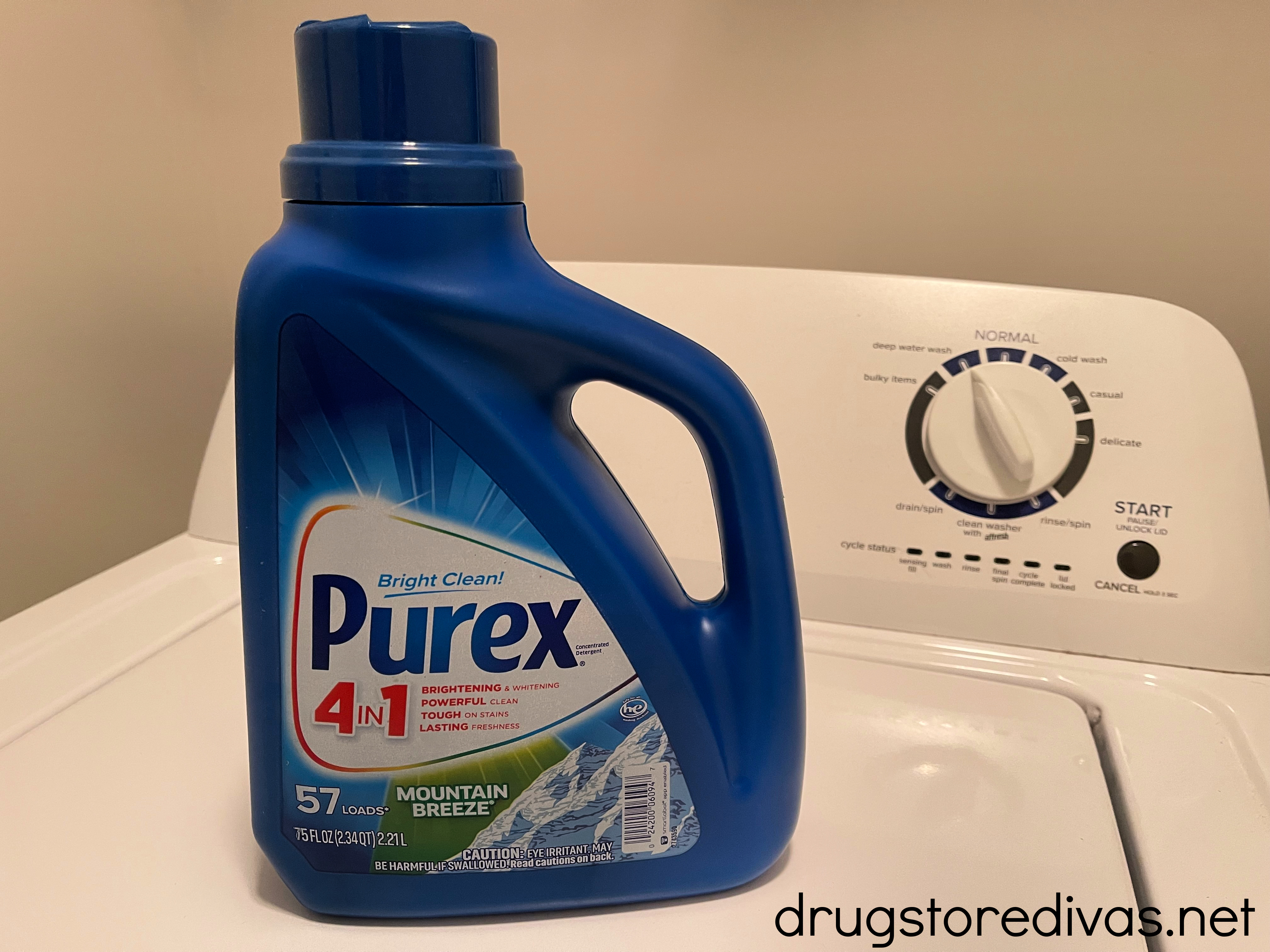 Bottle of Purex laundry detergent on a washing machine.