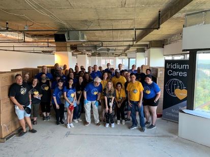 IridiumBoss's tweet photo. Happy/tired/proud - just finished packing over 51,000 meals for DC-area families with my HQ/SNOC team as part of our first-ever Iridium Impact Day. AZ team starting soon - even UK and AUS teams involved! With great success comes great responsibility... #IridiumCares https://t.co/m9V90yvlyC