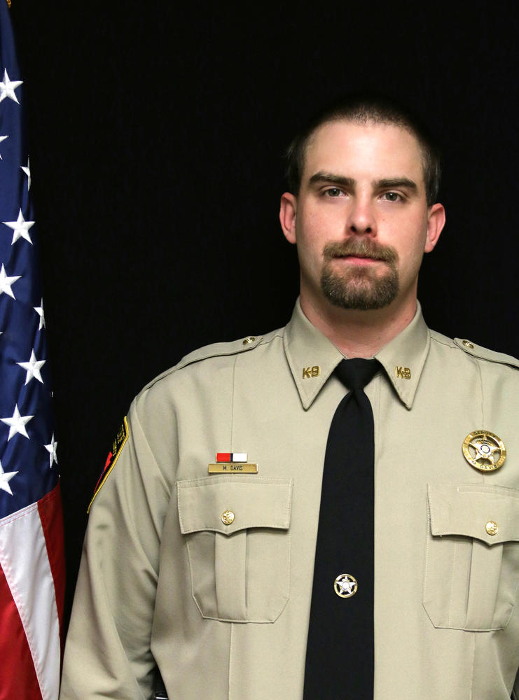 I had a hell of a time digging this up and it's a little out of date but here's a photo from 2016 of Sgt. Michael Davis of the Lonoke County Sheriff,  responsible for the death of #HunterBrittain