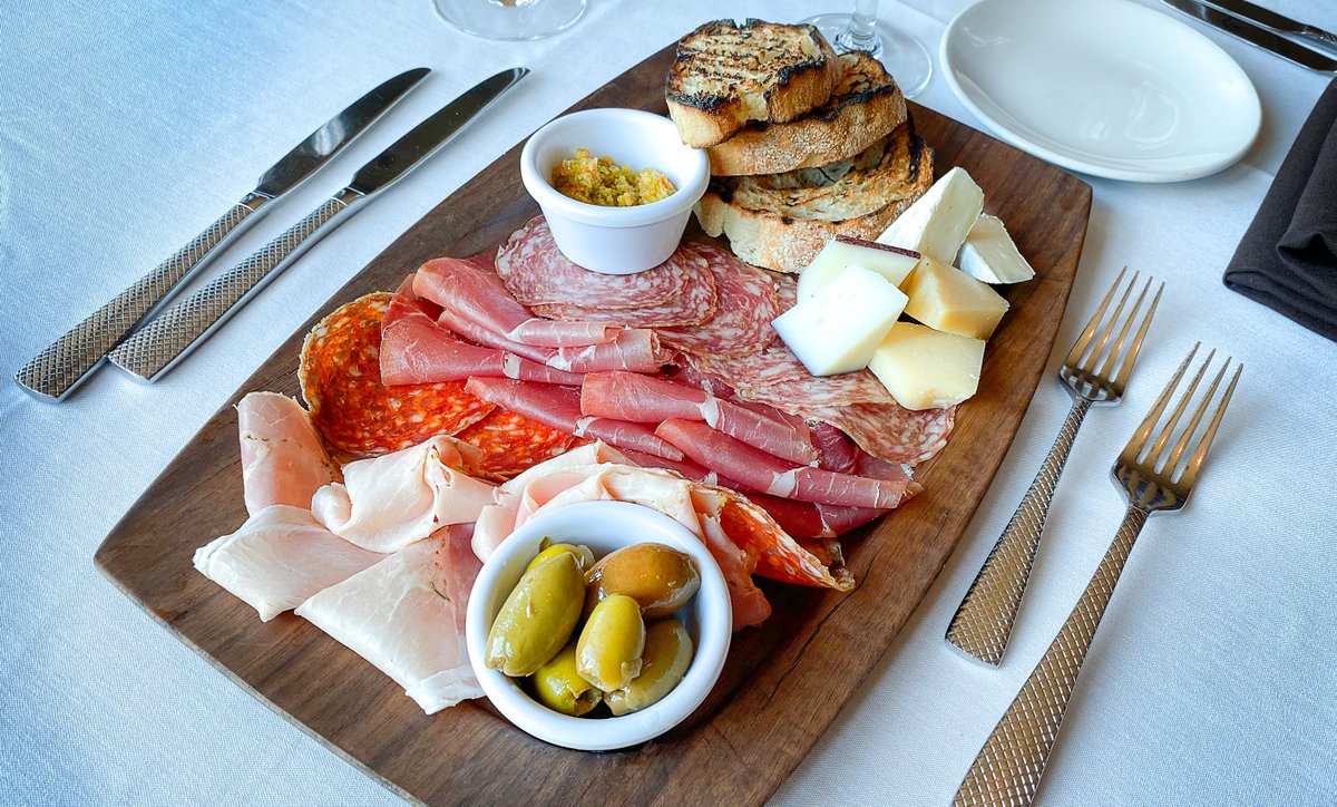You can never go wrong starting a meal with a Charcuterie Platter. Imported from Italy, the Charcuterie Platter includes a fine selection of cured meats, cheese and accompaniments.