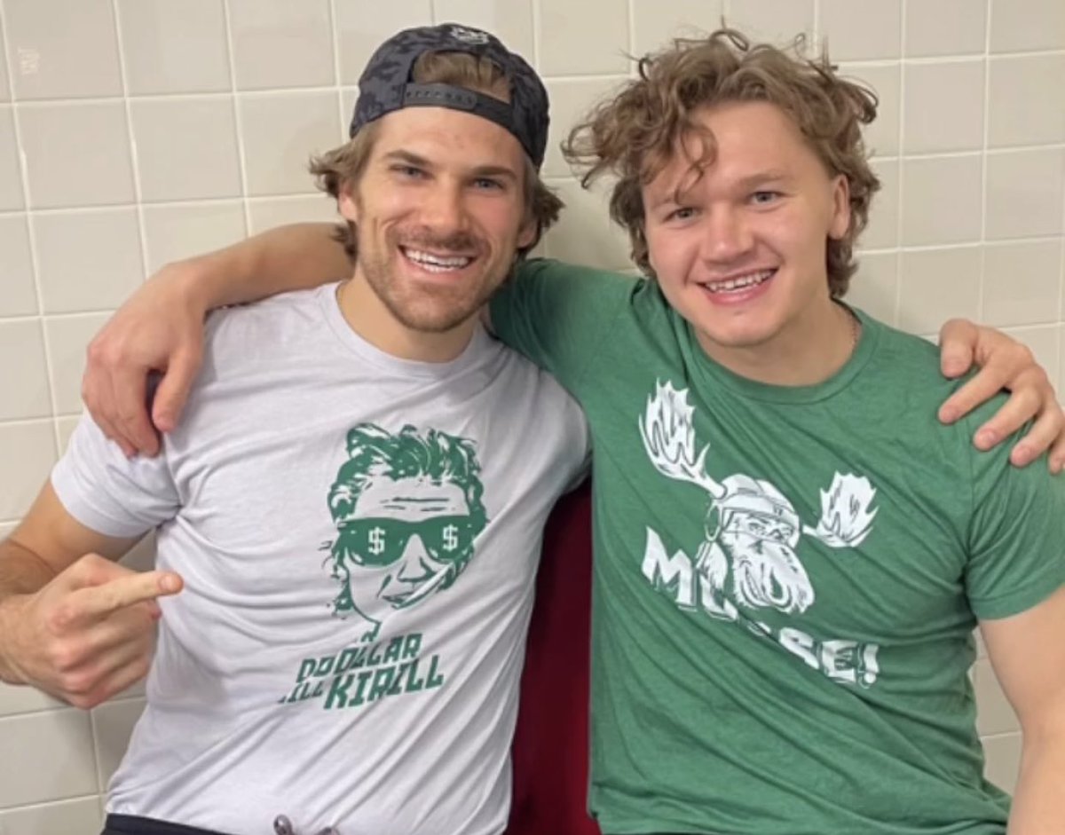 B_Marsh92's tweet photo. Here’s the most important picture you’ll see today: Kirill wearing a Moose shirt while posing with Moose who is in a Kirill shirt 😊 #mnwild @SotaStickCo https://t.co/8Y5TDBnja4