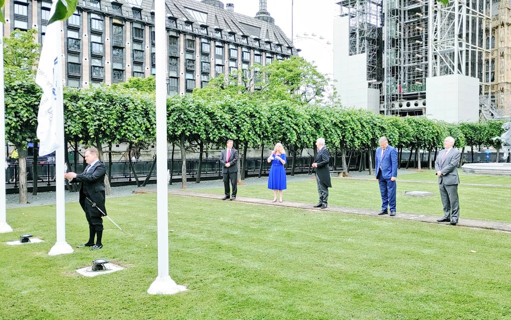 BGIPU's tweet photo. On #ParliamentDay @CommonsSpeaker, BGIPU Chair @hbaldwin &amp; Executive Committee members attend a flag-raising ceremony at @UKParliament marking 30 June as the founding day of @IPUparliament 132 yrs ago now being the world's oldest multilateral political org. #WorldParliamentDay https://t.co/Tv95r29l01