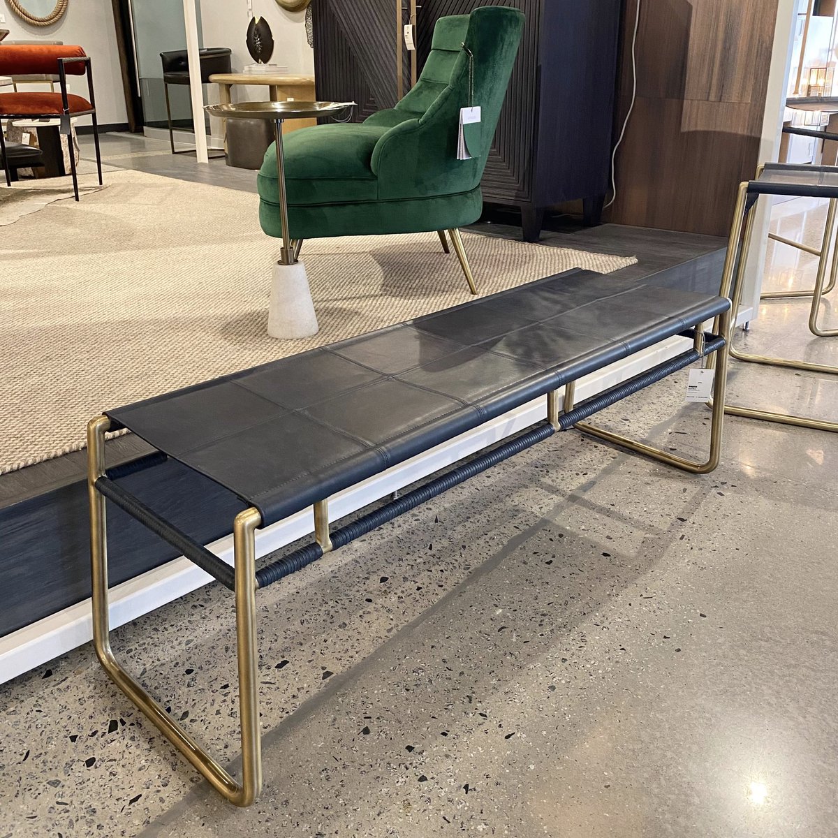A marriage of form and function, the Gasper Bench from <a href="/arteriorshome/">Arteriors</a> has a refined meets rustic vibe. An indigo leather seat lends an organic touch to the modern style of its antique brass frame. #ClaytonGrayHome
