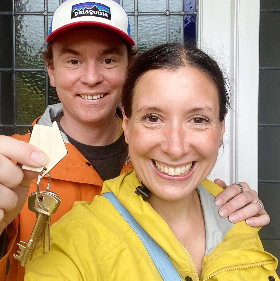 Stef and Emily holding the keys to our new house