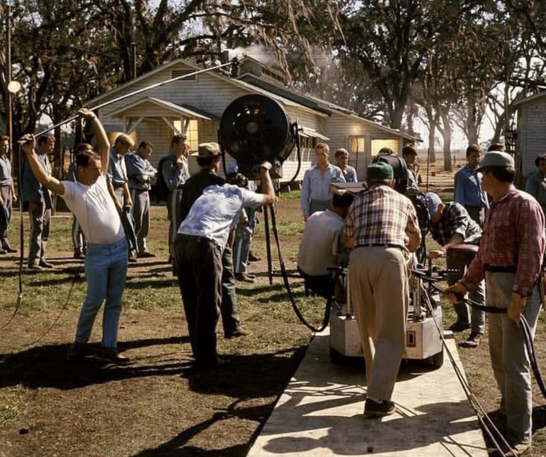 manatee73's tweet image. Just saw this BTS pic from Cool Hand Luke and noticed the boom op. He’s standing like that because he’s using an aluminum pole with a mic on it that weighs probably 5 pounds. #boomoperator #respect